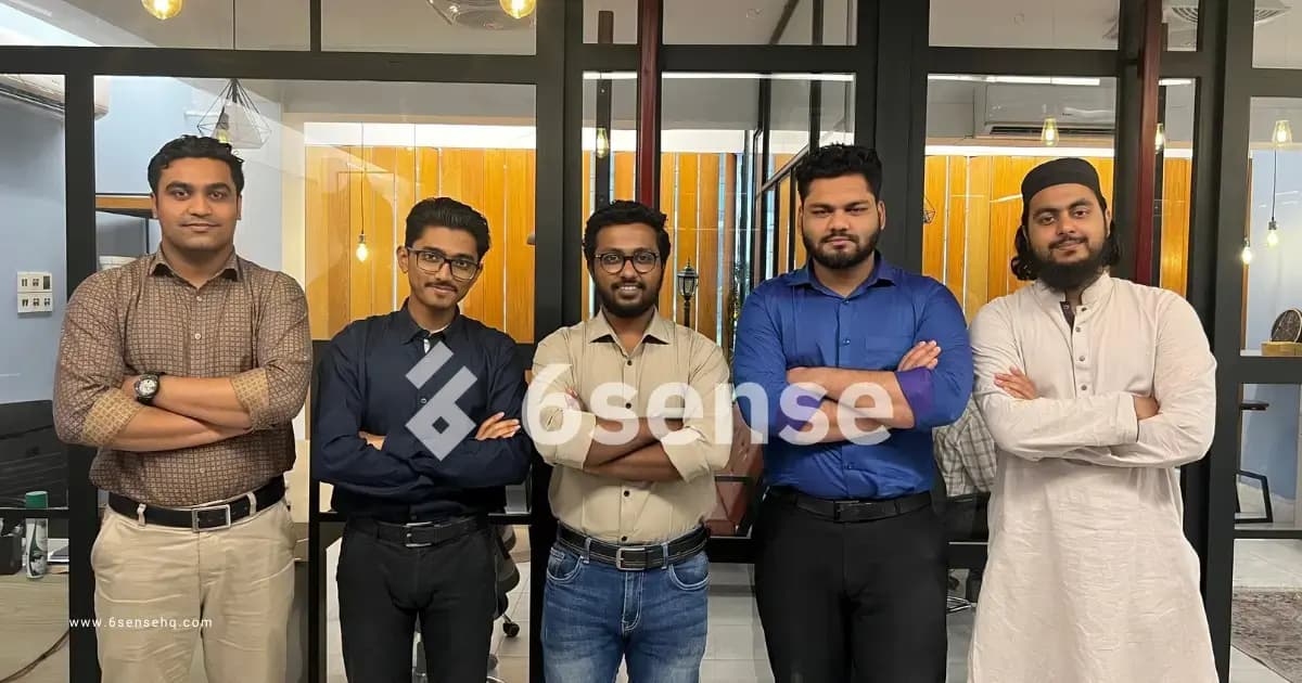 few peoples are standing side by side together in a modern office space